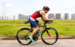triathlete, triathlon, ironman, cycling, road cycling, lower back pain, lower back ache, strength training, barbell training
